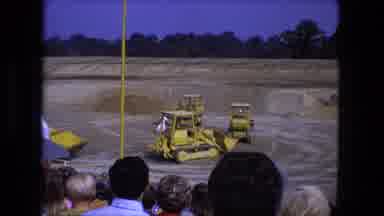 Fort Wayne Indiana-1974: Bulldozers Circling Around A Single Man Inside Of A