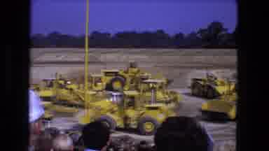 Fort Wayne Indiana (1974): Yellow Tractors And Dump Trucks Participate In A Race