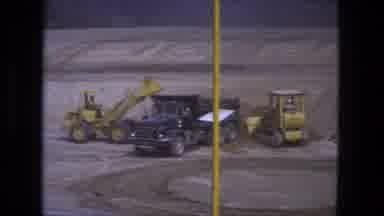 Fort Wayne Indiana (1974): Front Loader Trucks Loading Dirt On Construction Site