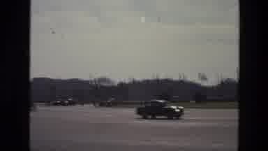 India (1974): A Busy City Life With Traffic Of Motorist And Cyclist Around