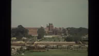 India (1974): Camera Pans In On Distant Building Which Looks Like A Mosque