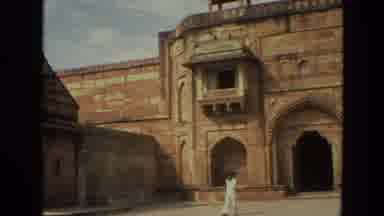 India (1974): Footage Of A Man Walking The Grounds In Front Of Historical