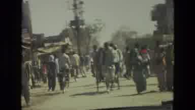 India (1974): A Busy Street Of South Asia With People Engaged In Different