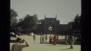 INDIA-1974: Tourists at Historic Gateway with Taj Mahal View