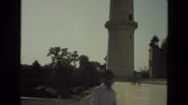 INDIA-1974: Quick Shot Of A Palace In India Cuts To A Man Standing Near A Turret