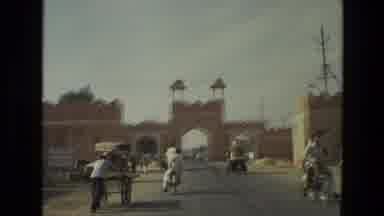 India (1974): People In Another Country Riding Bbn On Bikes And Camels