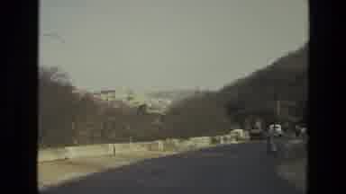 India (1974): Road Near Mountains And Lots Of Trees With A Cyclist Walking