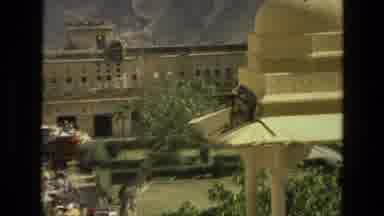 India (1974): Monkey On The Roof Of A Large Building Or Temple Has Something It Is