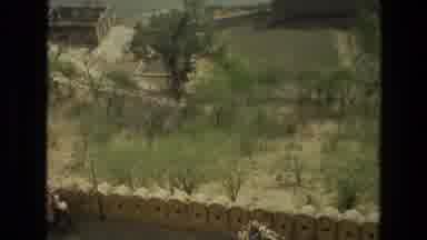 India (1974): A Scene Of A Very Long Stone Wall Taken On A Sunny Day