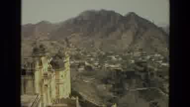 India (1974): View Of White Buildings Nestled Amongst Brown Mountains On A Clear