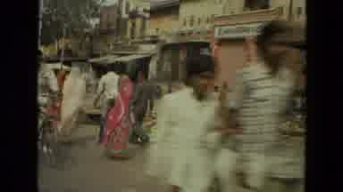 India (1974): Moving Shot Taken On An Asian City Street As People Pass By