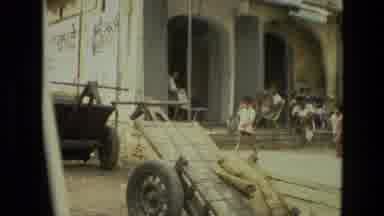 India (1974): Driving Through A Poor City With Kids Men And Animals Share The