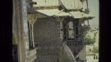 India (1974): Camera Zooms In On The Birds That Are Perched On The Building Next