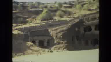 India (1974): Buildings Made From Concrete Buried Under Some Rocks And Rubble