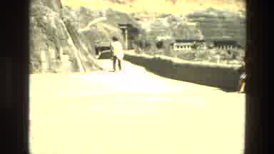 India (1974): Mountainous Place With A Lying Statue A Lady Sitting And Two People