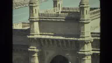 India (1974): Zoom Shot Of The Gateway Of India From High Angle With Boats And