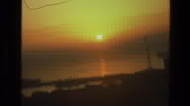 India (1974): Sun Setting On Hazy Afternoon Over The Wide Steamy Bay