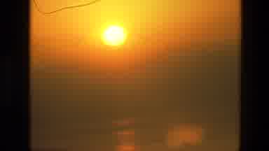 India (1974): Orange Glowing Setting Sun Over The Calm Peaceful Glass-Like