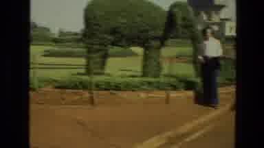 India (1974): Lady Standing With Large Topiary Elephant And Other Plants