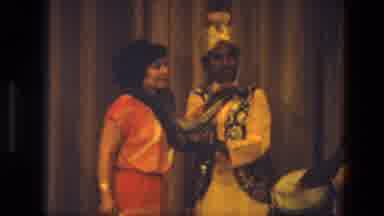 India (1974): A Snake Handler And A Lady Stand On Stage During A Show With Dancers