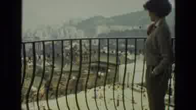 India (1974): A Woman Observing On A Balcony And Pointing To Something She Is