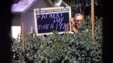Lincoln Nebraska (1974): Man Holds Sign With Notice That On The Written Date And