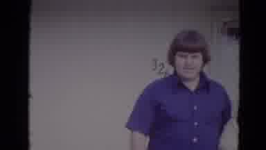 Lincoln Nebraska (1974): Two People In Front Of A Door With Numbers Behind Them