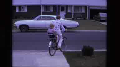 California USA (1975): Parents Taking Their Children Out For A Bicycle Ride In A