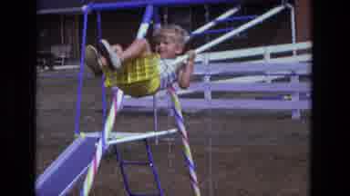 California USA (1975): Woman Pushing A Boy On A Swing And A Little Girl Sliding