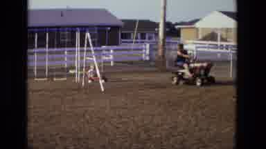 California USA (1975): Person Wearing Black Shirt Tows Child Wearing White Shirt