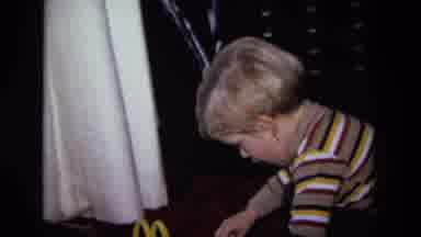 California USA (1975): A Kid Playing With Toys And Having Fun