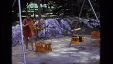 California USA (1975): Swinging A Child On A Wooden Swing Going Higher And Higher