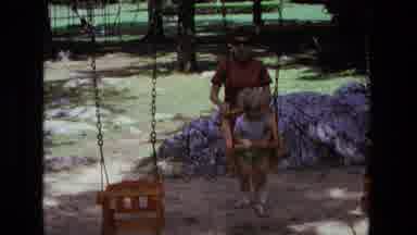 California USA (1975): Mom Swinging Son From Tree Branch Home Movie Clip 1970s
