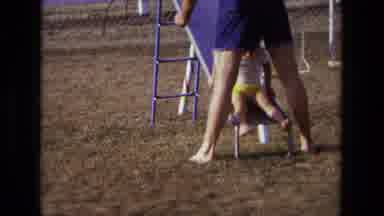 California USA (1975): Kid Is Playing With His Father In The Park