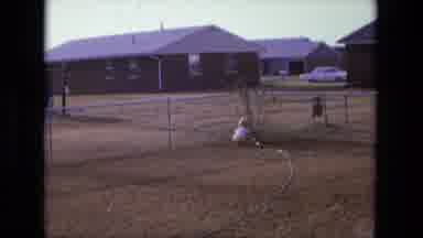 California USA (1975): Boy Meching In A Hose
