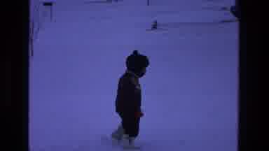 California USA (1975): A Little Boy Enjoying Walking On Ice