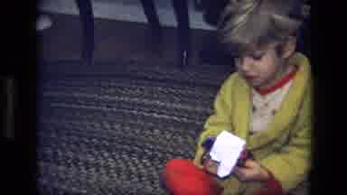California USA (1975): A Young Boy Playing On The Floor