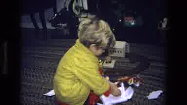California USA (1975): Child Opening Christmas Stocking