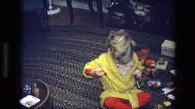 California USA (1975): Child Plays In The Living Room With Toys Showing Lots Of