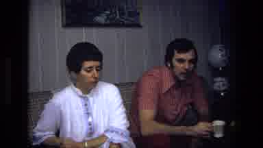 California USA (1975): Family Members Of Men And Women Talking While Taking Tea
