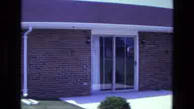 California USA (1975): Large Red Brick Building With Glass Doors And Green Lawn