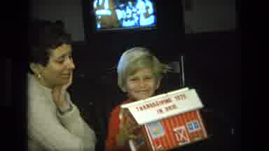 California USA (1975): A Child With A Mother In A House Doing Some Fun Activity