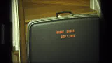 California USA (1975): A Suitcase Reads Home Again Dec 1 1975