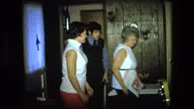 Fort Wayne Indiana (1976): Adults And Children Enter A Room In A House Preparing