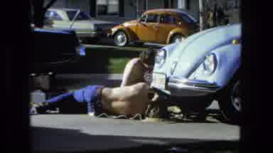 Fort Wayne Indiana (1976): Two Persons Working On The Road To Repair The Car