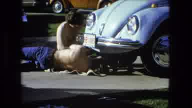 Fort Wayne Indiana (1976): Fixing A Car Outside In The Sun In A Parking Lot Fixing
