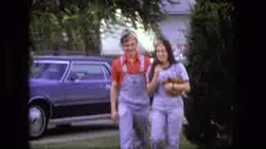 Fort Wayne Indiana (1976): A Couple Cover Their Faces And Laugh Sheepishly As They