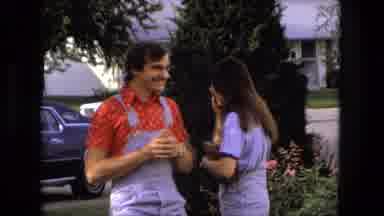 Fort Wayne Indiana (1976): Woman Walks Past House And Laughs With A Friend