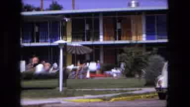 Fort Wayne Indiana (1976): A Hotel Busy With Guests Moving Around And A Poolside