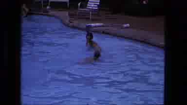 Fort Wayne Indiana (1976): Two Young People Playing In Outdoor Pool Of Water